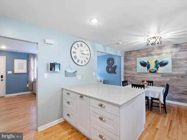 a living room with furniture and a clock