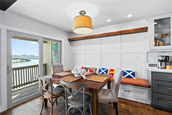 a large kitchen with stainless steel appliances and a sink