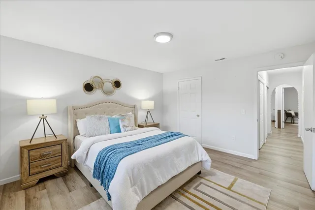 a bedroom with a bed and a walk in closet