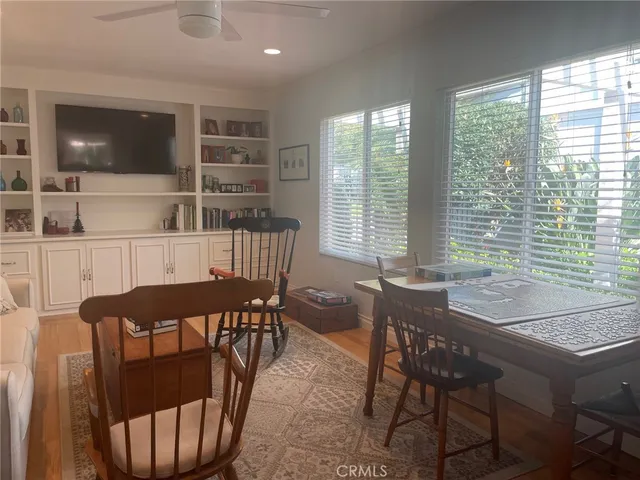 a view of a dining room with furniture and window