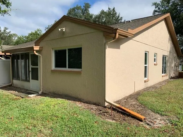 a view of a back yard of the house