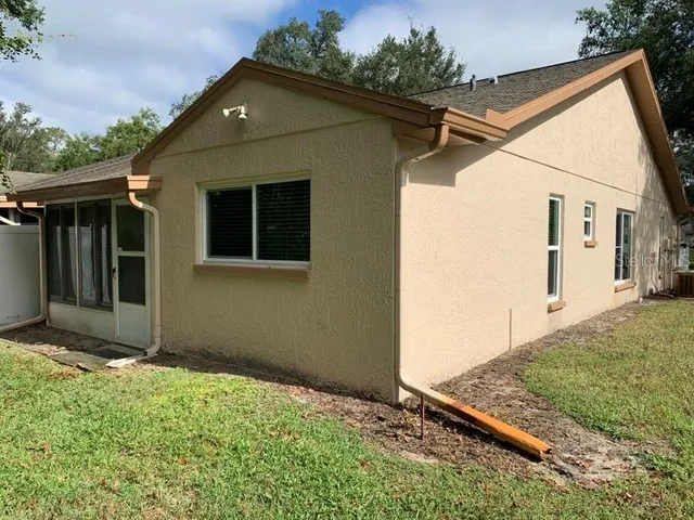 a view of a back yard of the house