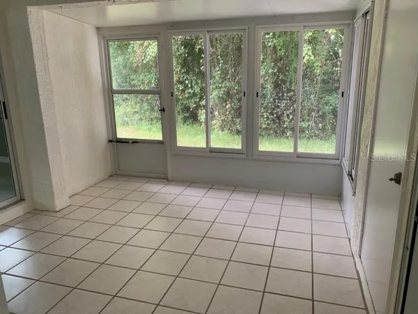 a view of an empty room and window