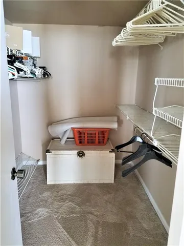 a view of a closet with storage