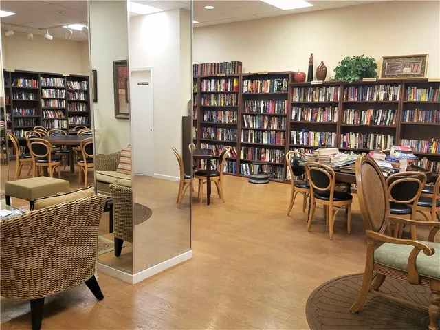 a room with pool table and windows