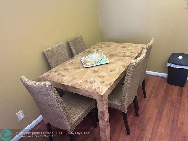 a kitchen with a refrigerator sink and cabinets