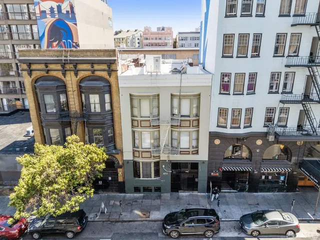 a front view of a building with street view