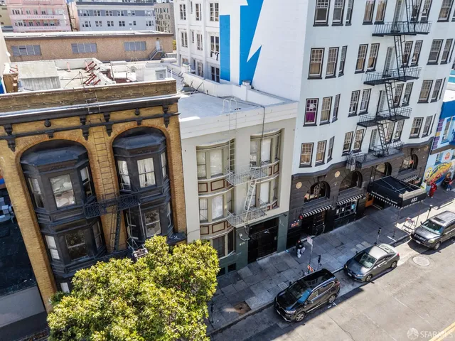 a front view of a building with many windows