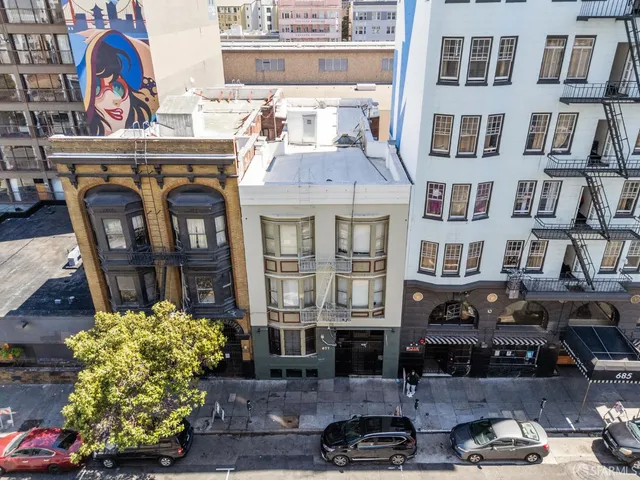 a front view of a building with glass windows