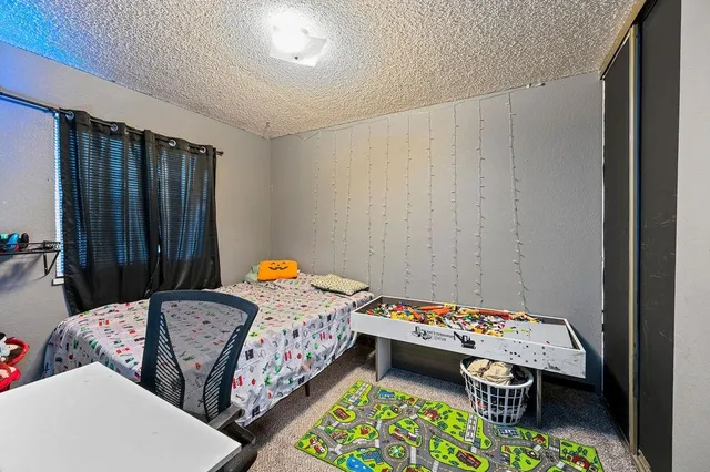 a bed room with a bed and a baby crib