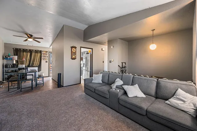 a living room with furniture and a table