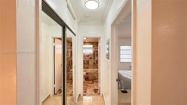 a bedroom with furniture and a flat screen tv