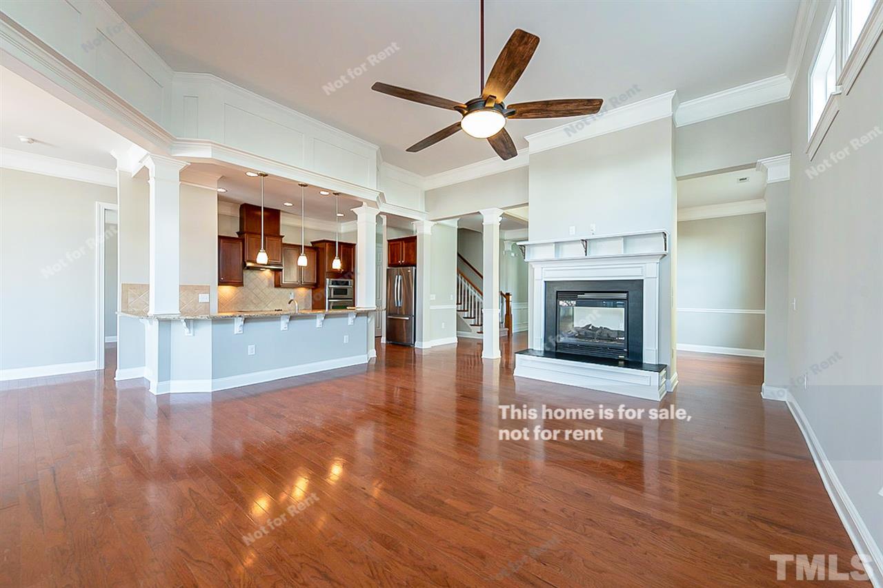 1225 Chapanoke Road Raleigh, NC 27603 - Photo 11 of 27 a view of a livingroom with a fireplace and window