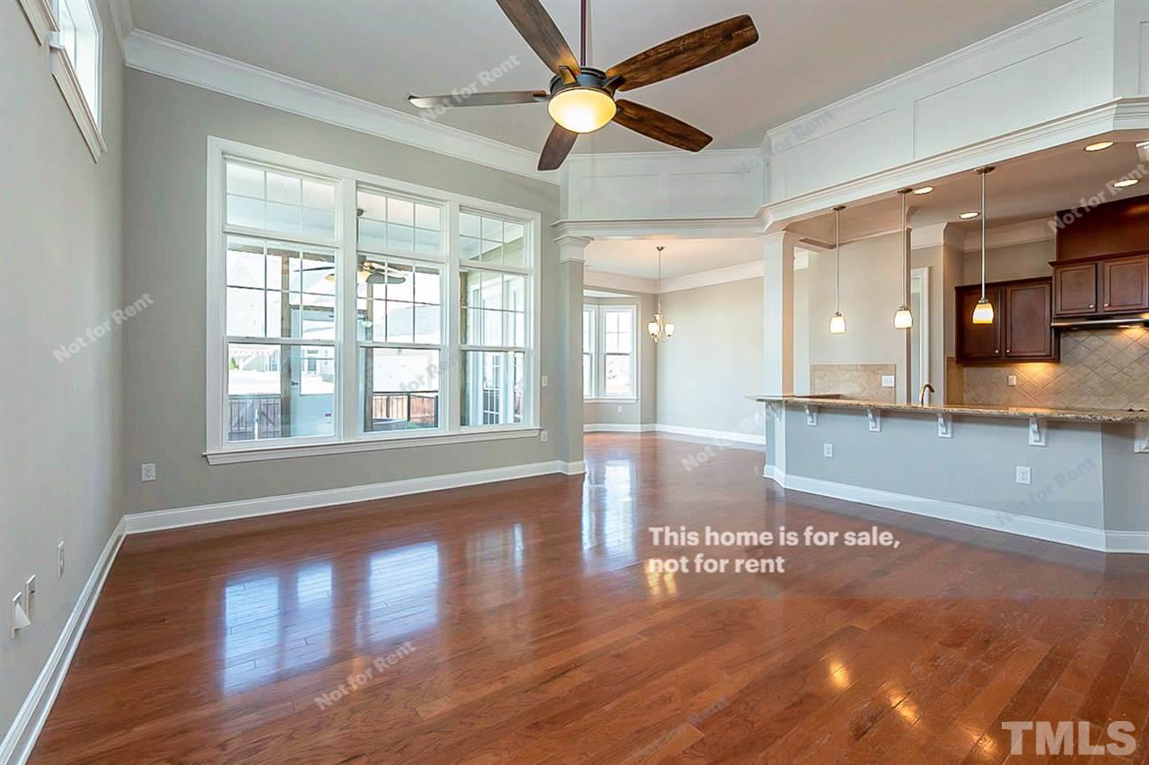 1225 Chapanoke Road Raleigh, NC 27603 - Photo 12 of 27 a view of empty room with wooden floor and fan