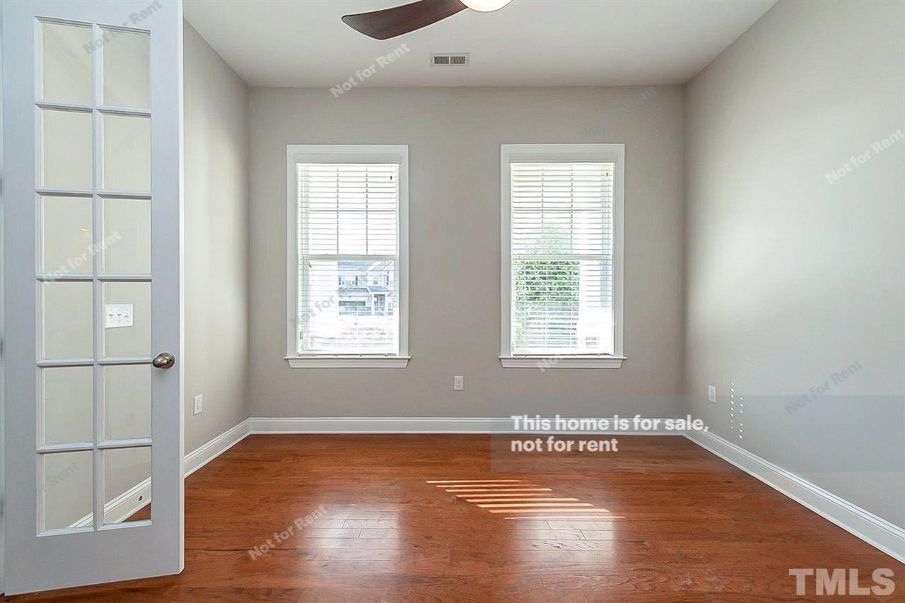 1225 Chapanoke Road Raleigh, NC 27603 - Photo 14 of 27 an empty room with wooden floor and windows