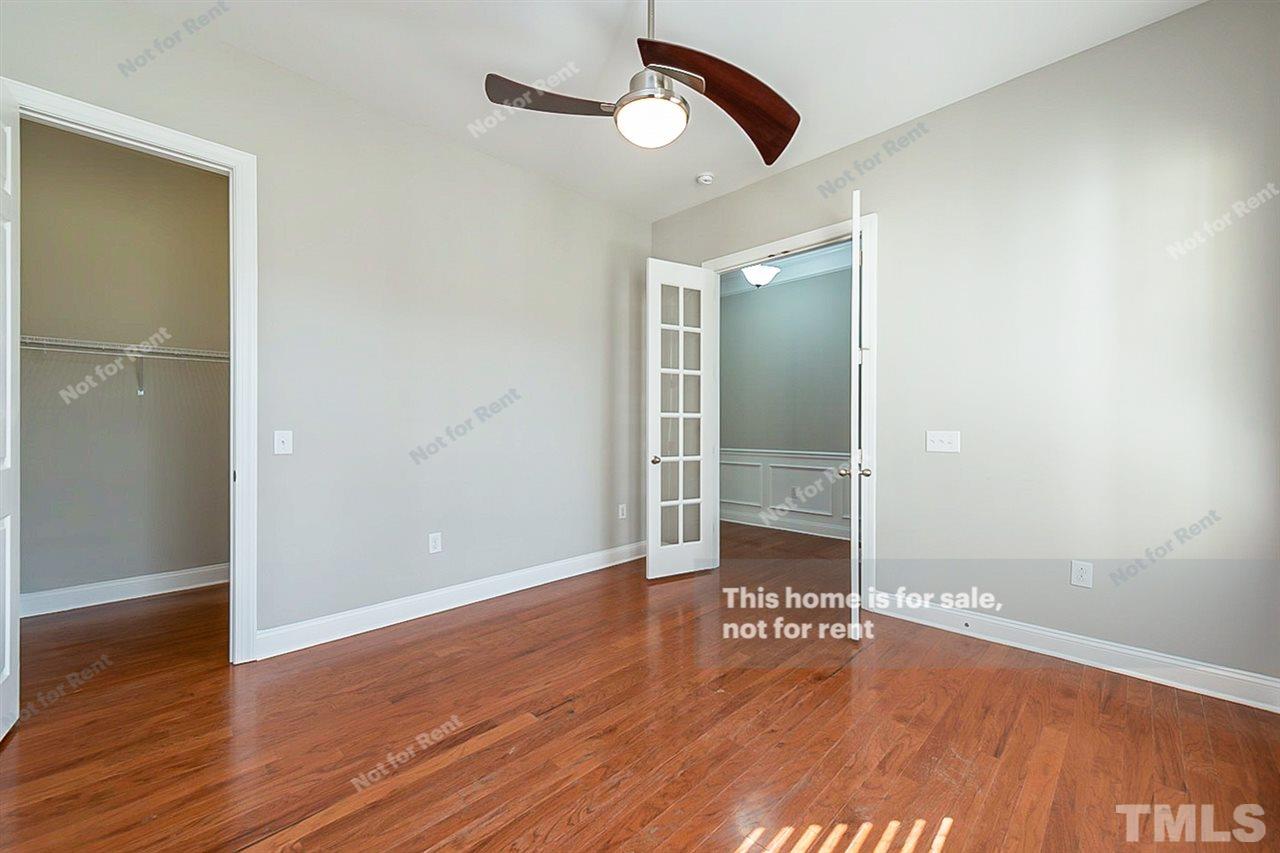 1225 Chapanoke Road Raleigh, NC 27603 - Photo 15 of 27 wooden floor in an empty room with a window
