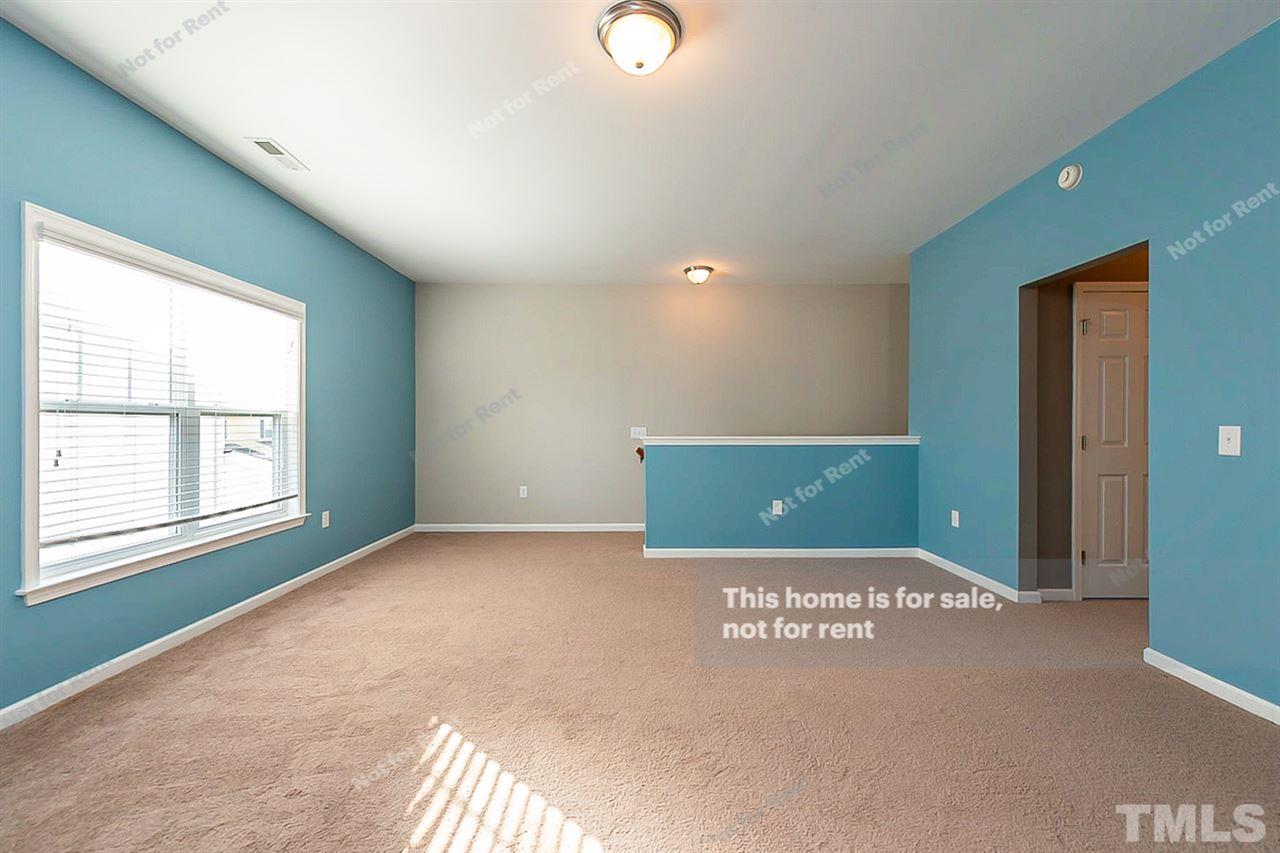 1225 Chapanoke Road Raleigh, NC 27603 - Photo 16 of 27 a view of a livingroom with an empty space and window