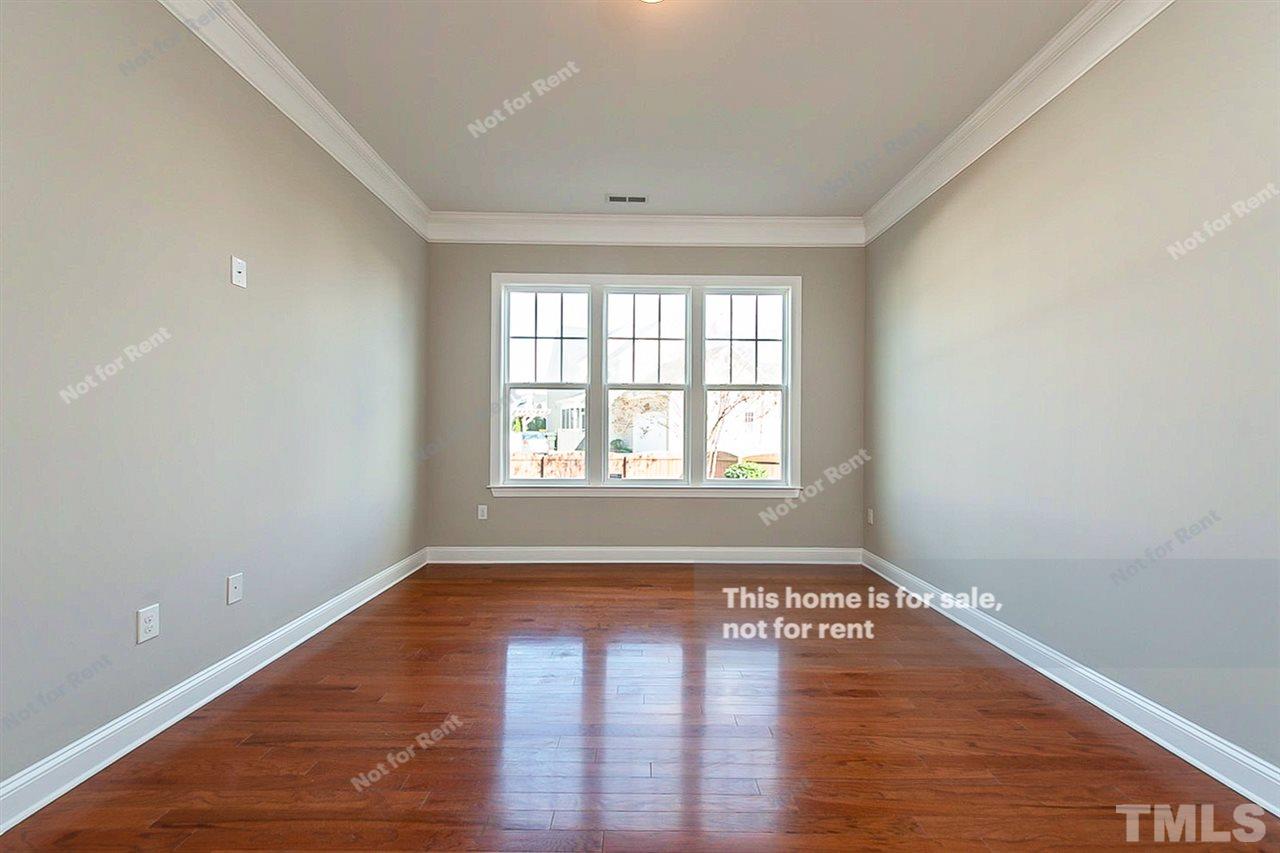 1225 Chapanoke Road Raleigh, NC 27603 - Photo 18 of 27 wooden floor in an empty room with a window