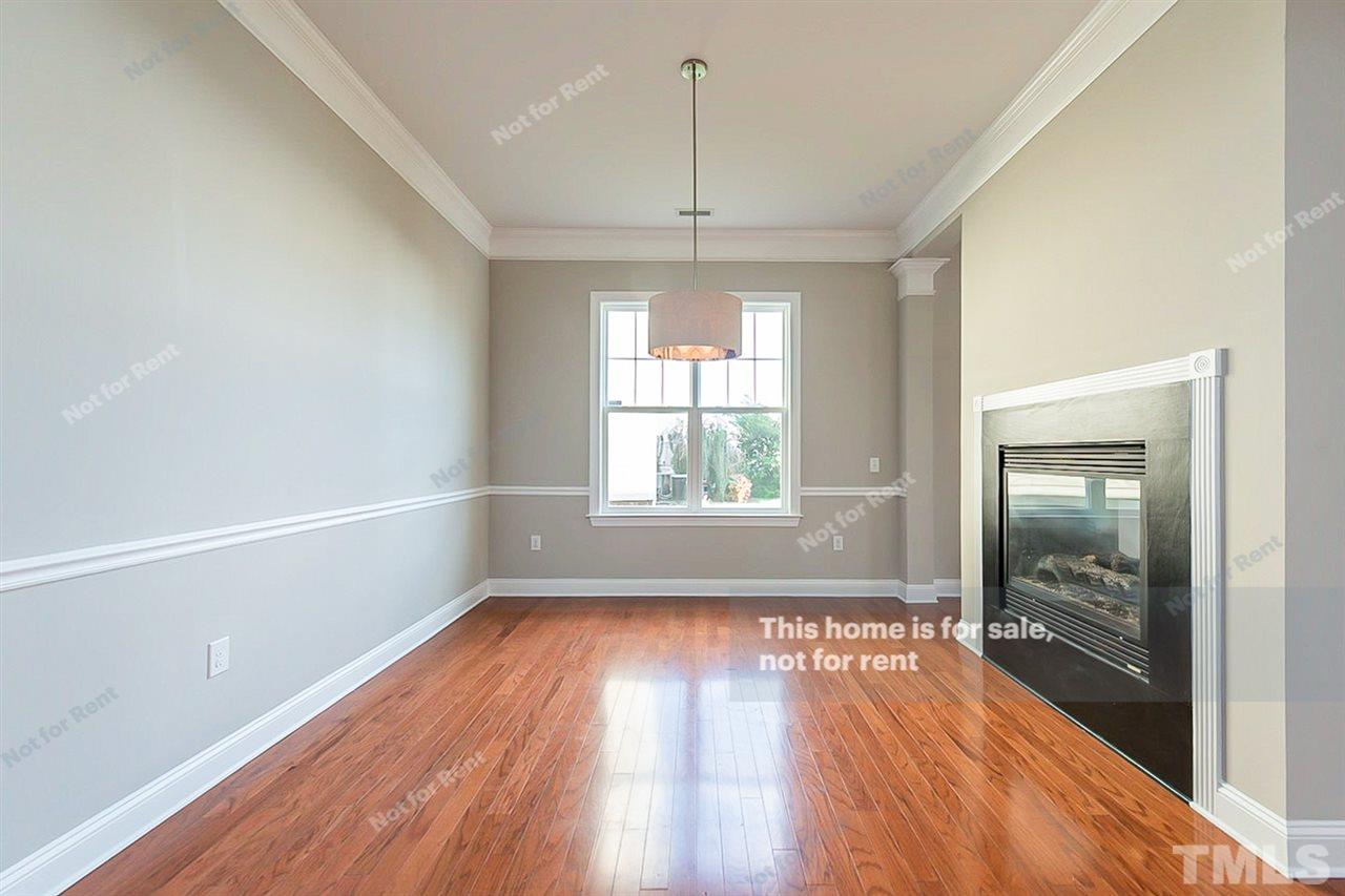 1225 Chapanoke Road Raleigh, NC 27603 - Photo 3 of 27 a view of empty room with wooden floor and fan
