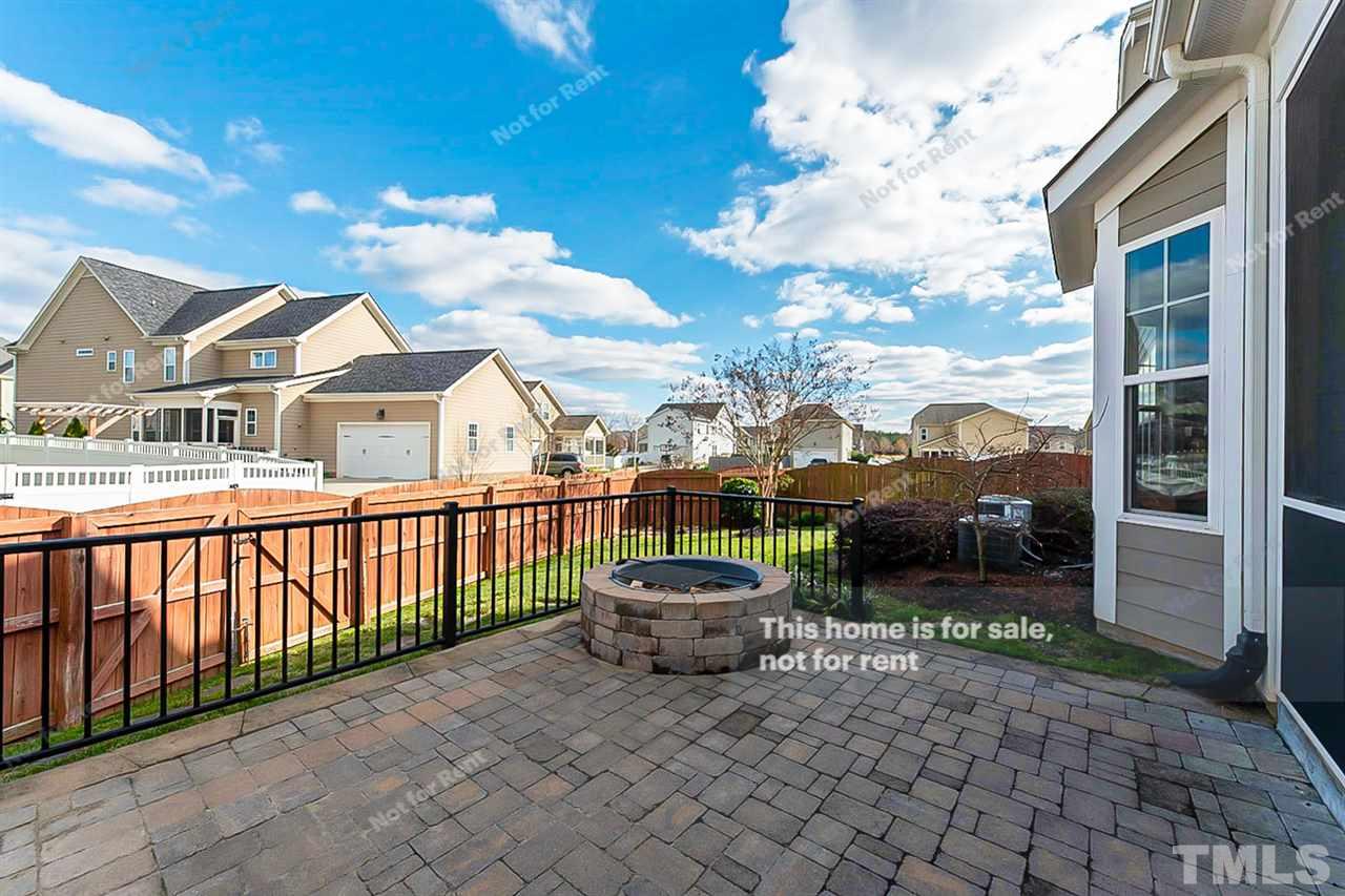 1225 Chapanoke Road Raleigh, NC 27603 - Photo 25 of 27 a view of a patio with a table and chairs and potted plants