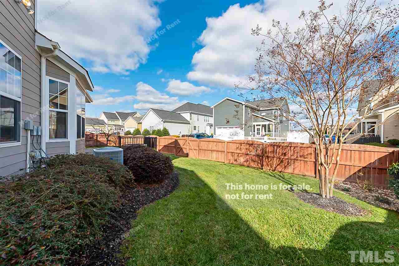 1225 Chapanoke Road Raleigh, NC 27603 - Photo 26 of 27 a view of a garden with a house