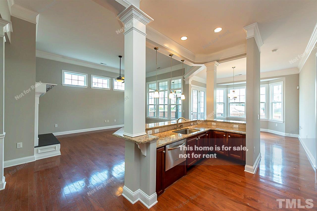 1225 Chapanoke Road Raleigh, NC 27603 - Photo 6 of 27 a spacious bathroom with a granite countertop sink and a large mirror