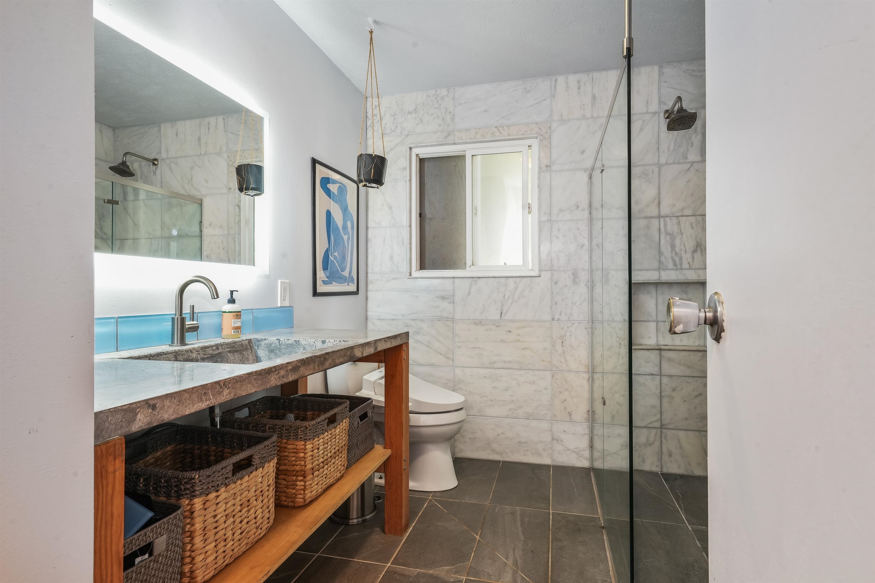 2889 West Lelehuna Place Haiku, HI 96708 - Photo 16 of 32 a bathroom with a sink a toilet and shower