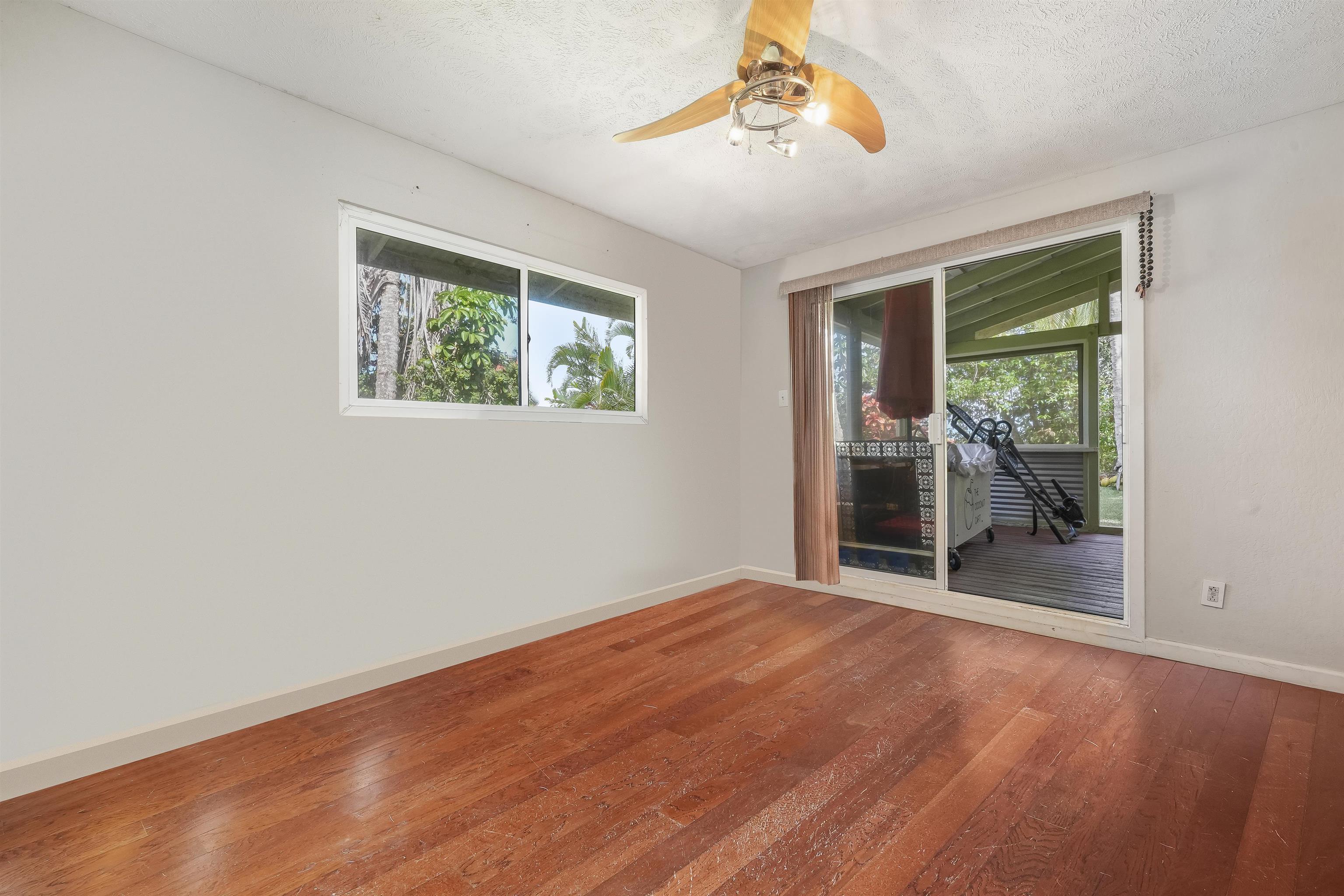 2889 West Lelehuna Place Haiku, HI 96708 - Photo 18 of 32 a view of an empty room with glass door and balcony