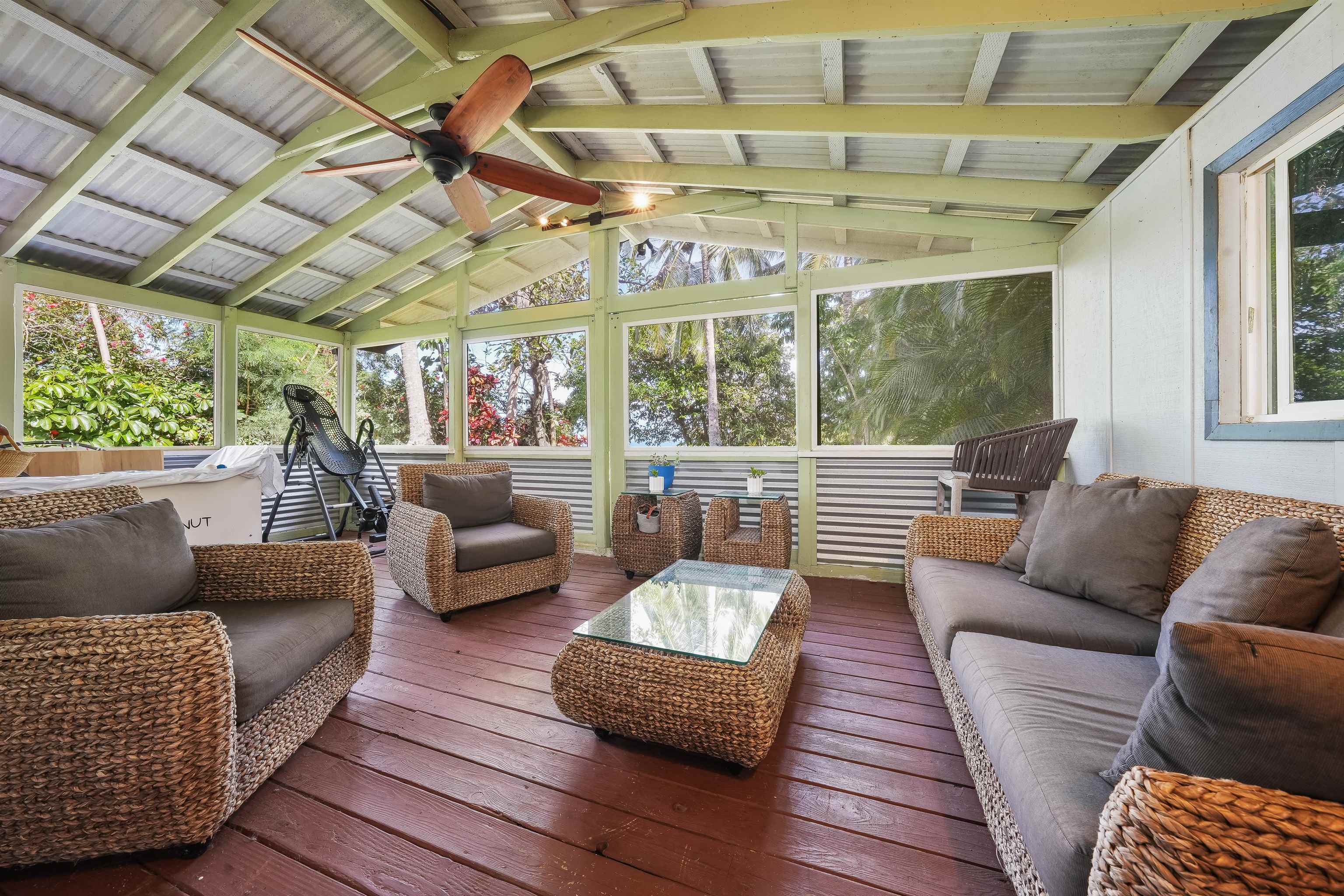 2889 West Lelehuna Place Haiku, HI 96708 - Photo 20 of 32 a living room with furniture and a large window