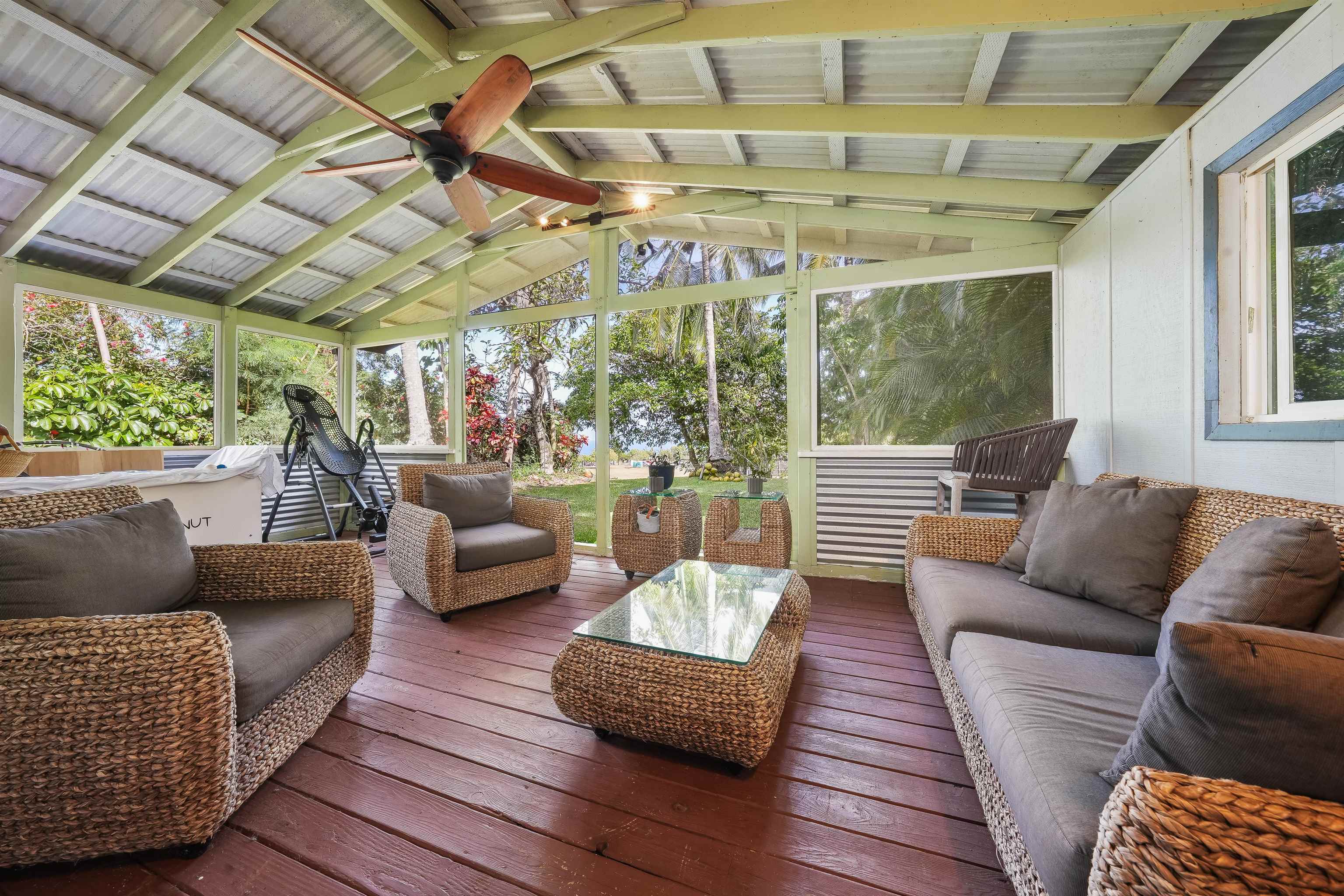 2889 West Lelehuna Place Haiku, HI 96708 - Photo 21 of 32 a living room with furniture and a large window