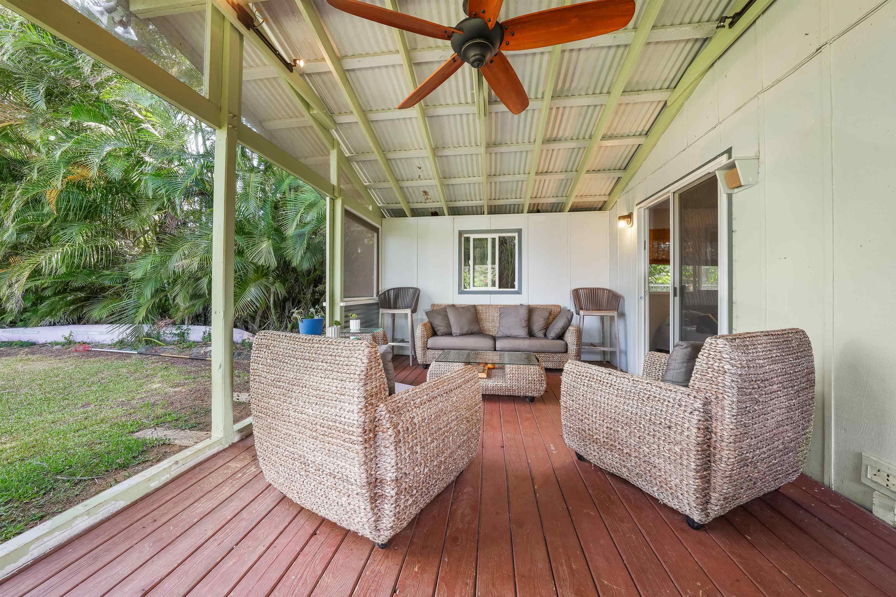 2889 West Lelehuna Place Haiku, HI 96708 - Photo 22 of 32 a outdoor space with patio the couches and a dining table with garden view