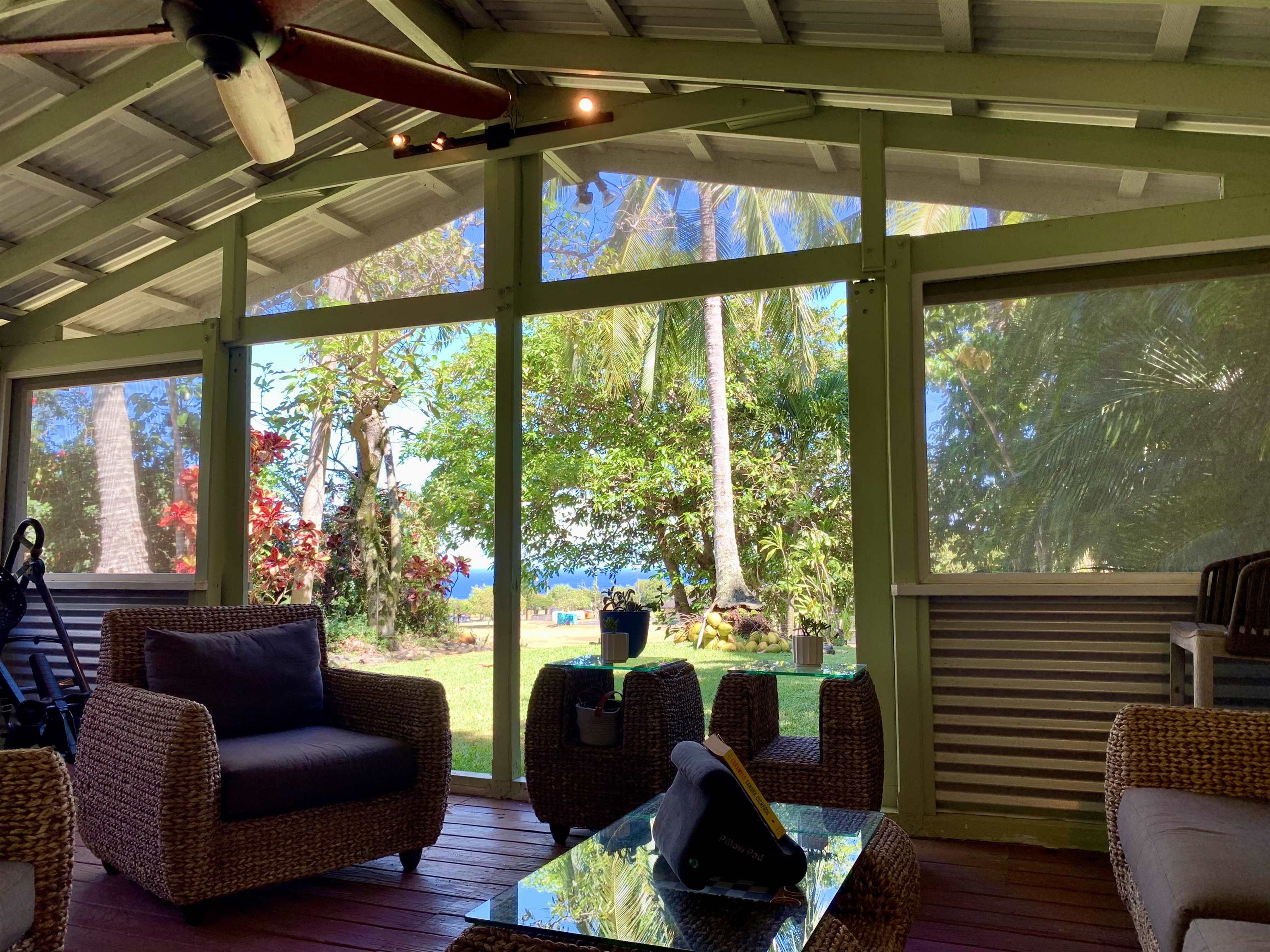 2889 West Lelehuna Place Haiku, HI 96708 - Photo 24 of 32 a living room with furniture and a floor to ceiling window