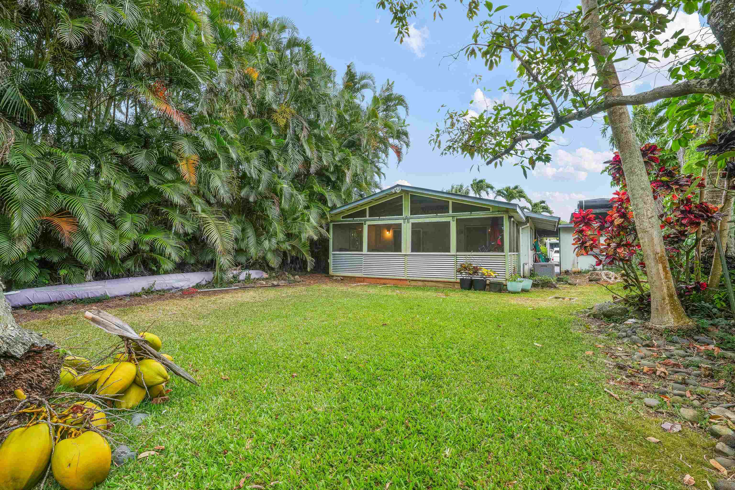 2889 West Lelehuna Place Haiku, HI 96708 - Photo 28 of 32 a view of a house with swimming pool and sitting area