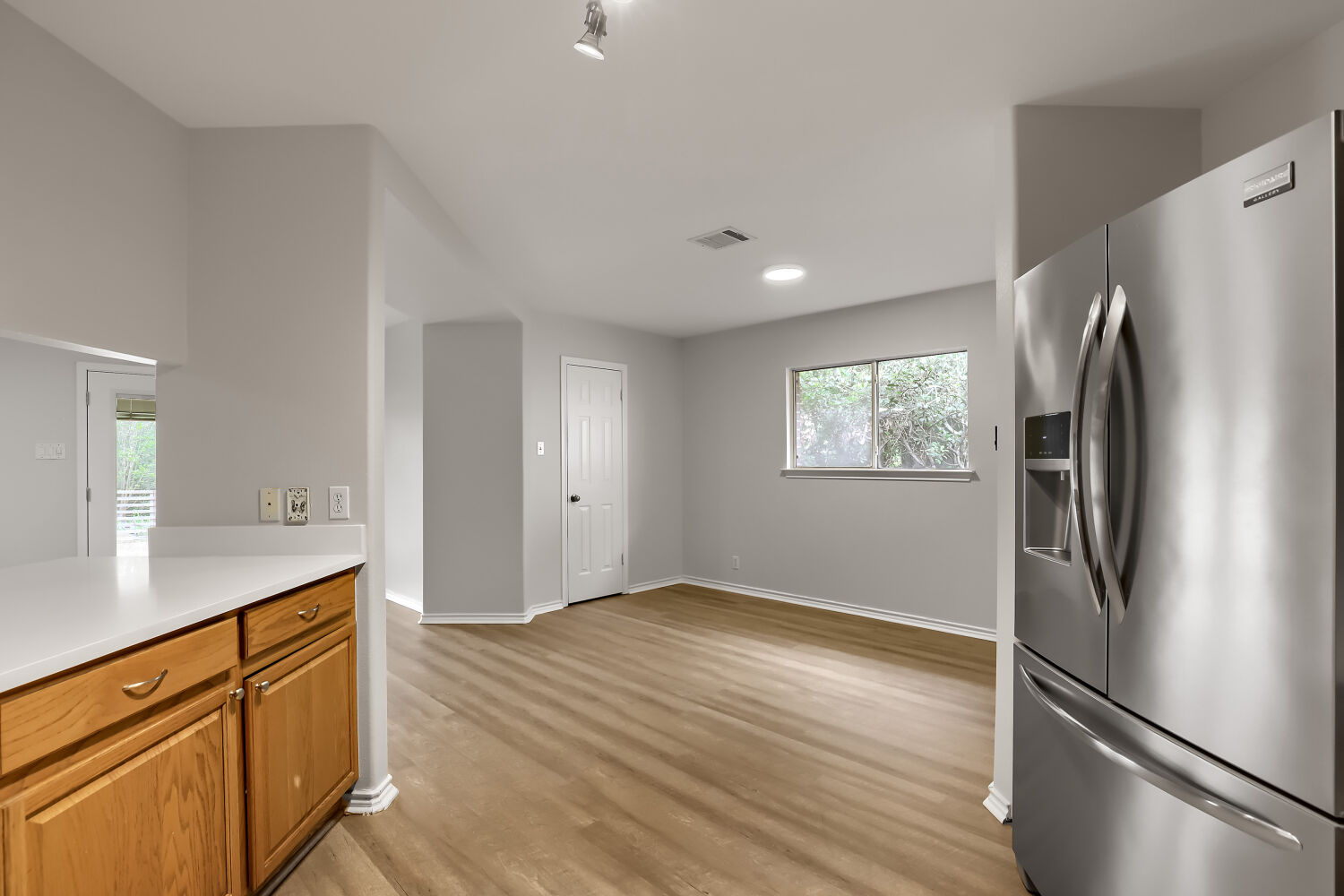 7411 Pusch Ridge Loop Austin, TX 78749 - Photo 12 of 29 a kitchen with stainless steel appliances granite countertop a refrigerator and a sink