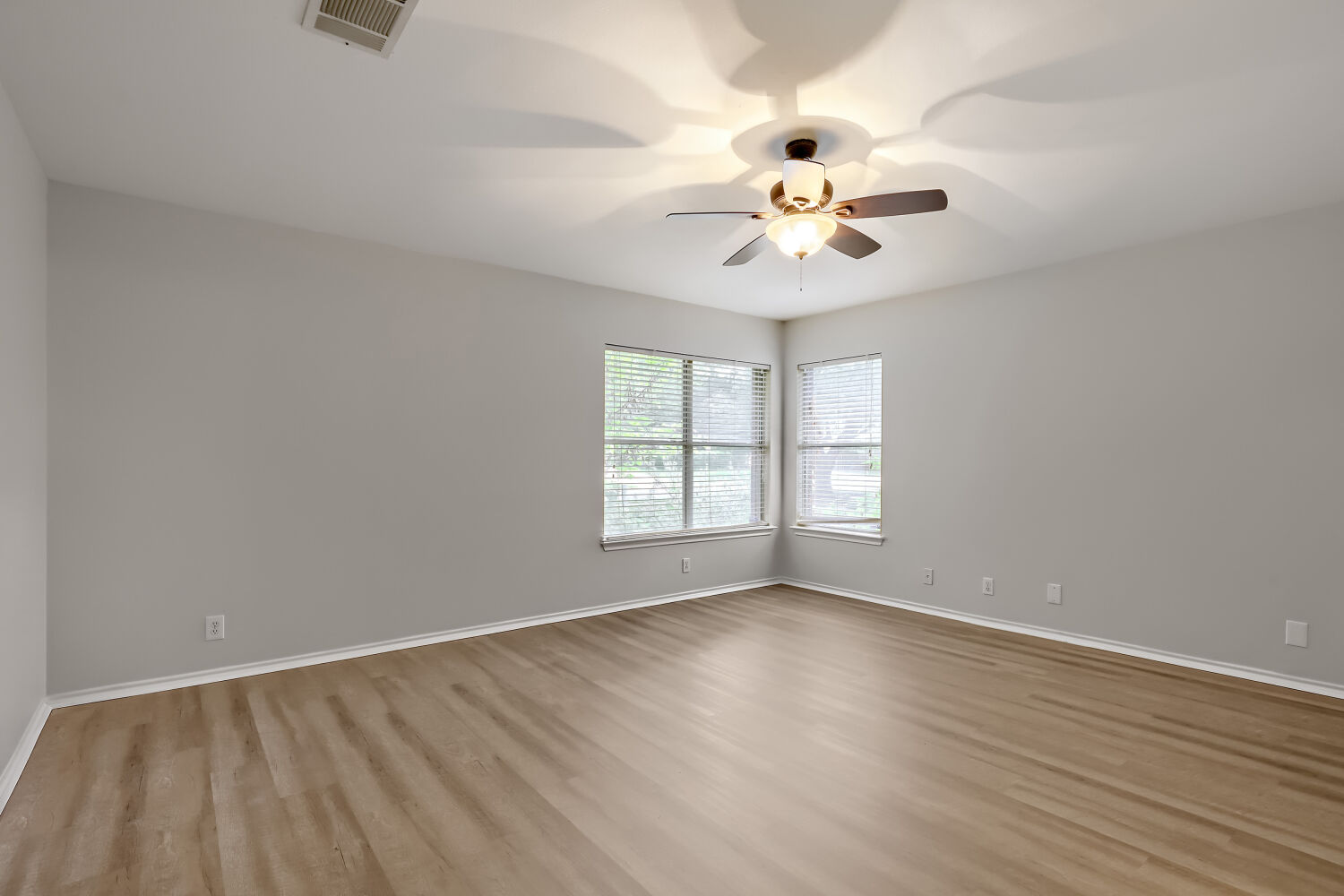 7411 Pusch Ridge Loop Austin, TX 78749 - Photo 15 of 29 wooden floor in an empty room with a window