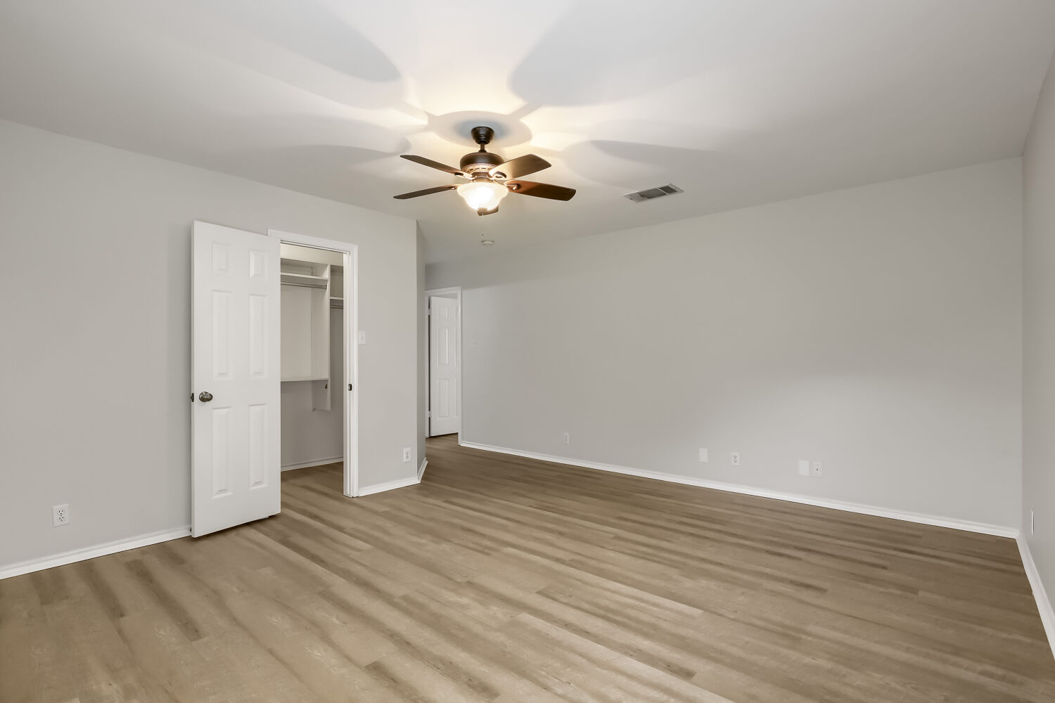 7411 Pusch Ridge Loop Austin, TX 78749 - Photo 16 of 29 a view of a room with wooden floor and ceiling fan