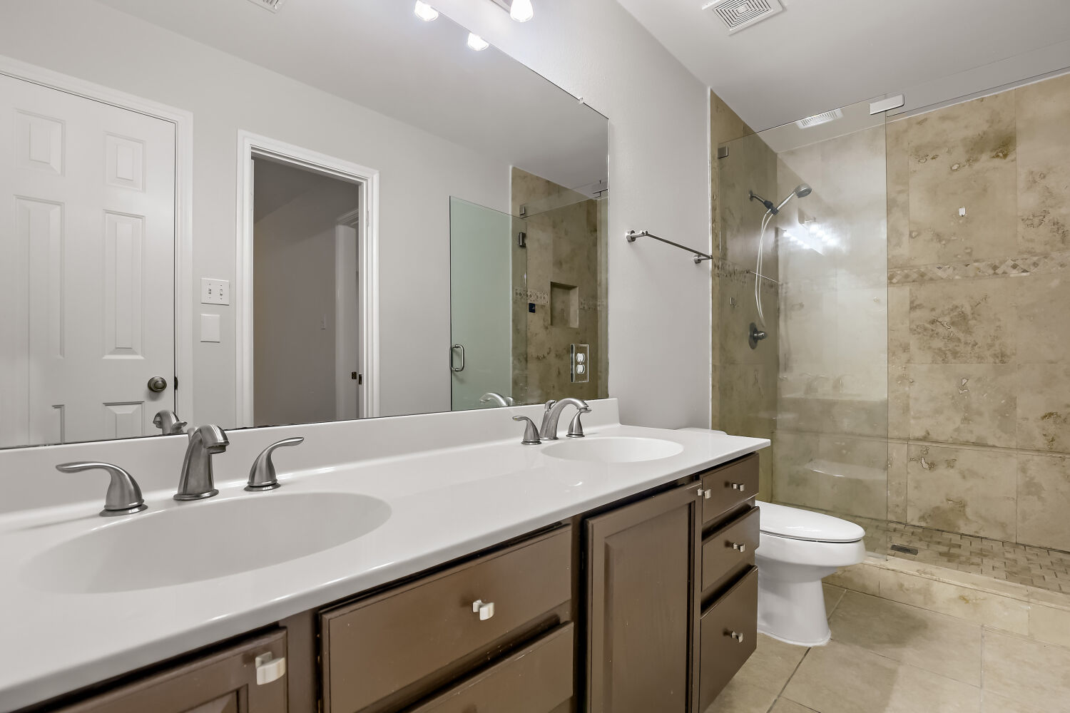 7411 Pusch Ridge Loop Austin, TX 78749 - Photo 18 of 29 a bathroom with a sink and mirror with toilet