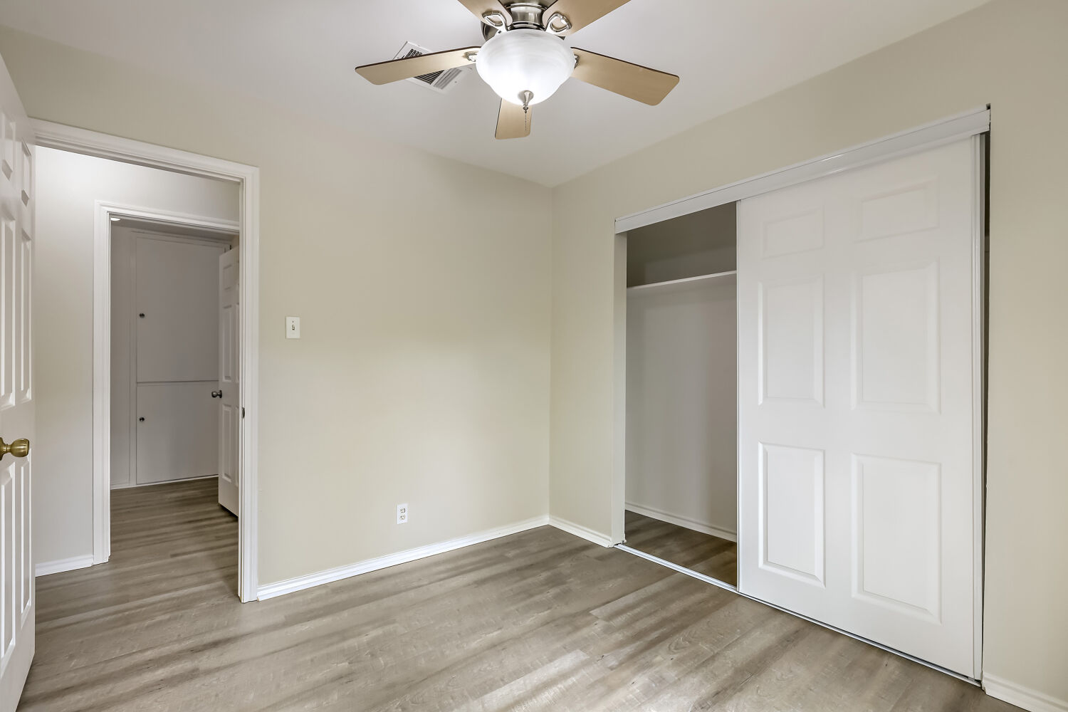 7411 Pusch Ridge Loop Austin, TX 78749 - Photo 23 of 29 a view of an empty room with wooden floor