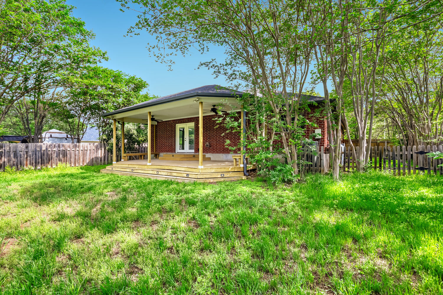 7411 Pusch Ridge Loop Austin, TX 78749 - Photo 26 of 29 a front view of a house with a garden