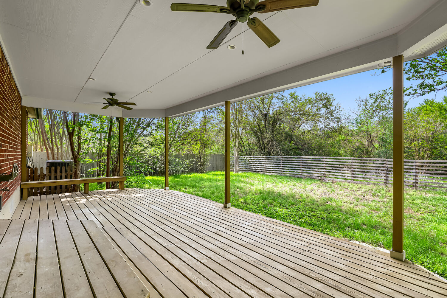 7411 Pusch Ridge Loop Austin, TX 78749 - Photo 4 of 29 a view of empty room with wooden floor and windows