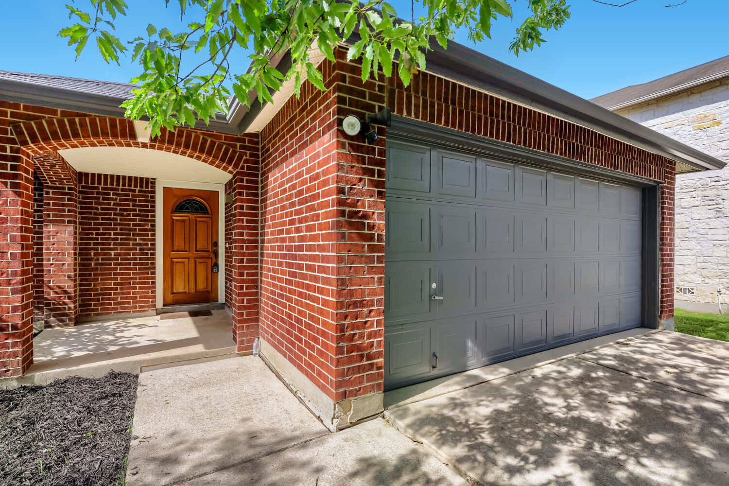 7411 Pusch Ridge Loop Austin, TX 78749 - Photo 6 of 29 a view of a house with a door and wooden walls