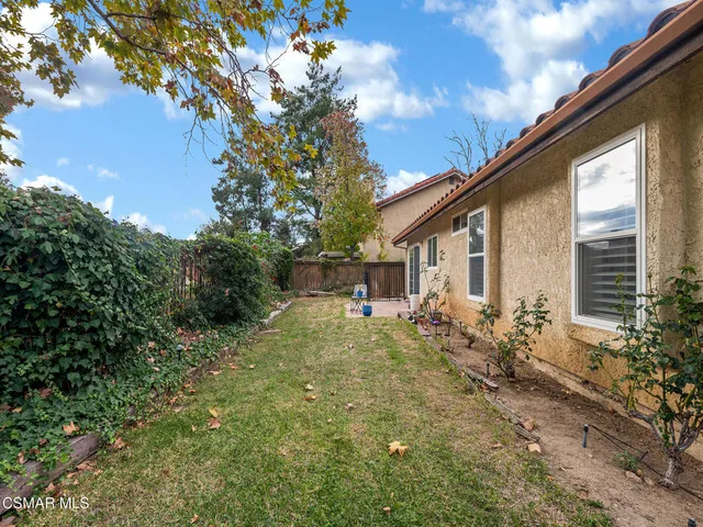 a house view with a backyard space
