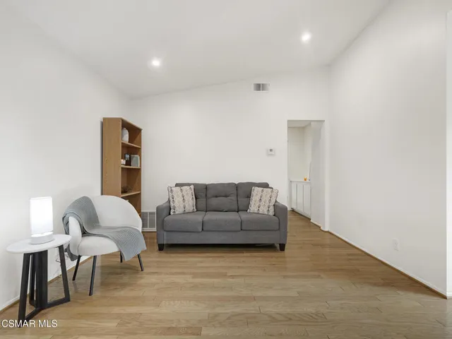 a living room with furniture and a couch