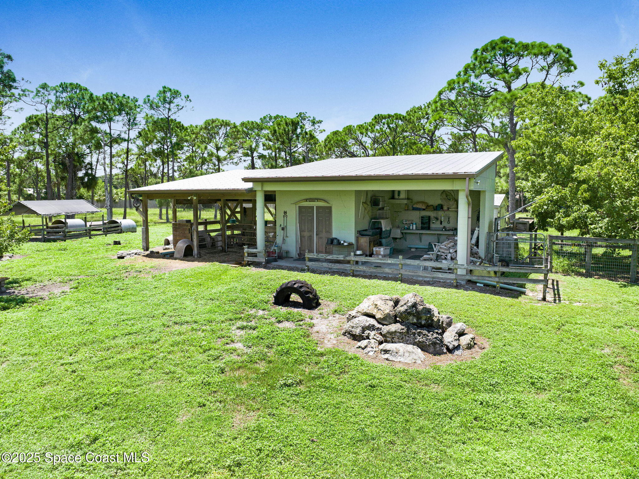 4495 Sand Point Road Grant, FL 32949 - Photo 12 of 87 a view of a house with a backyard porch and sitting area