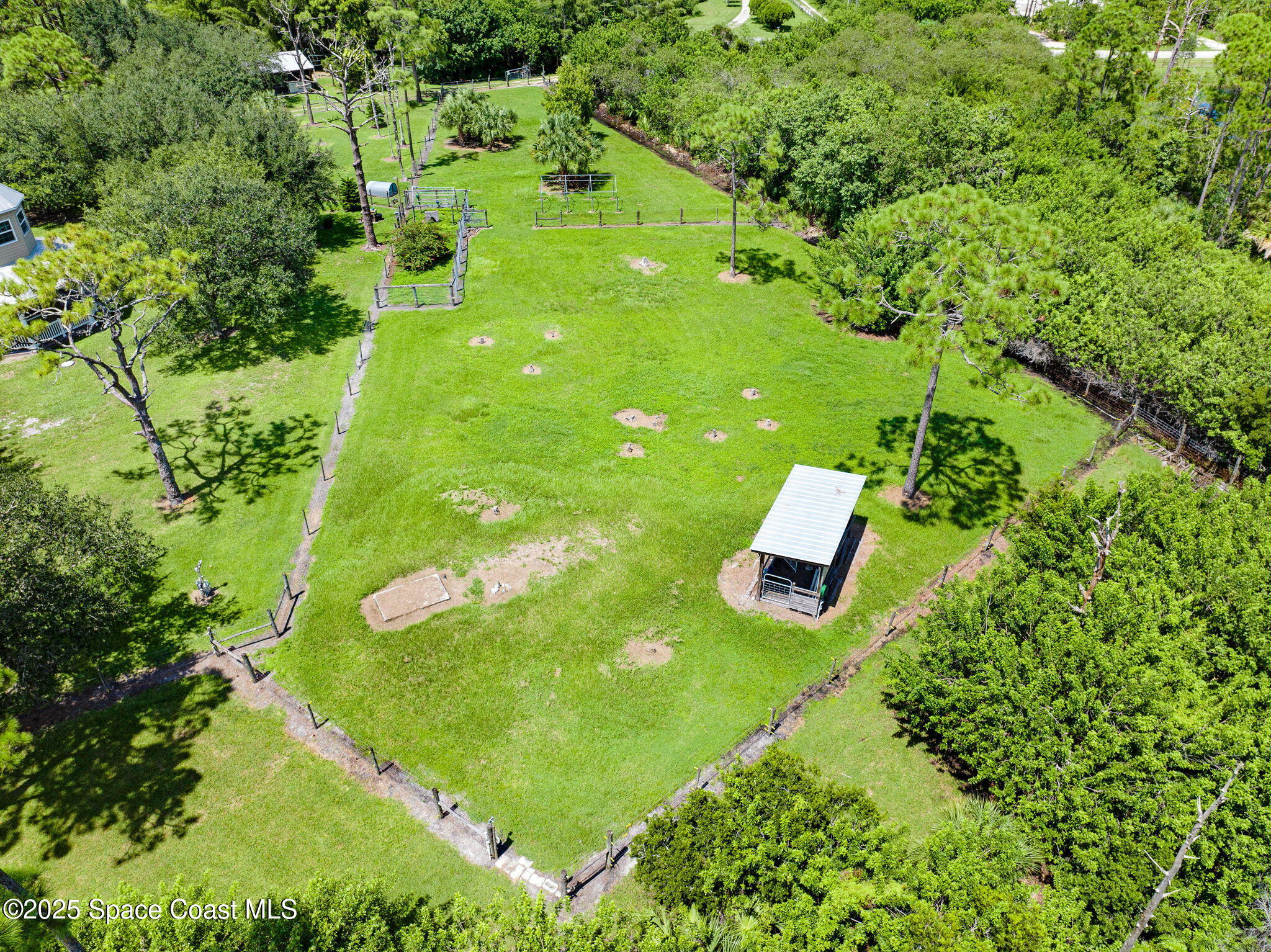 4495 Sand Point Road Grant, FL 32949 - Photo 24 of 87 a view of a golf course with plants