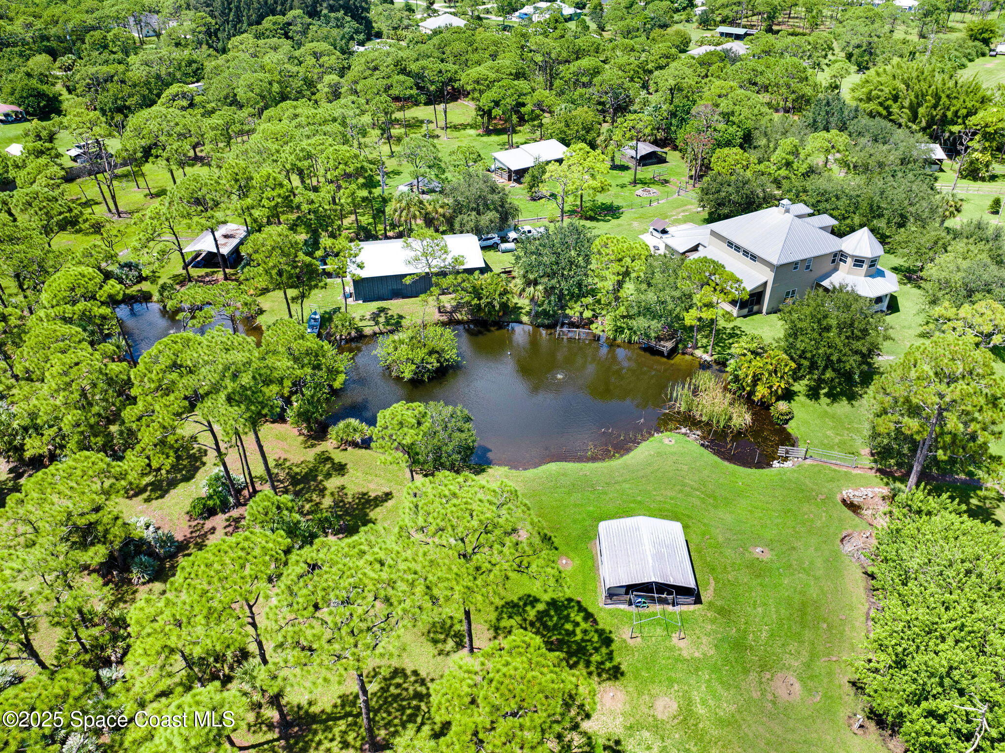 4495 Sand Point Road Grant, FL 32949 - Photo 25 of 87 an aerial view of a house with a yard