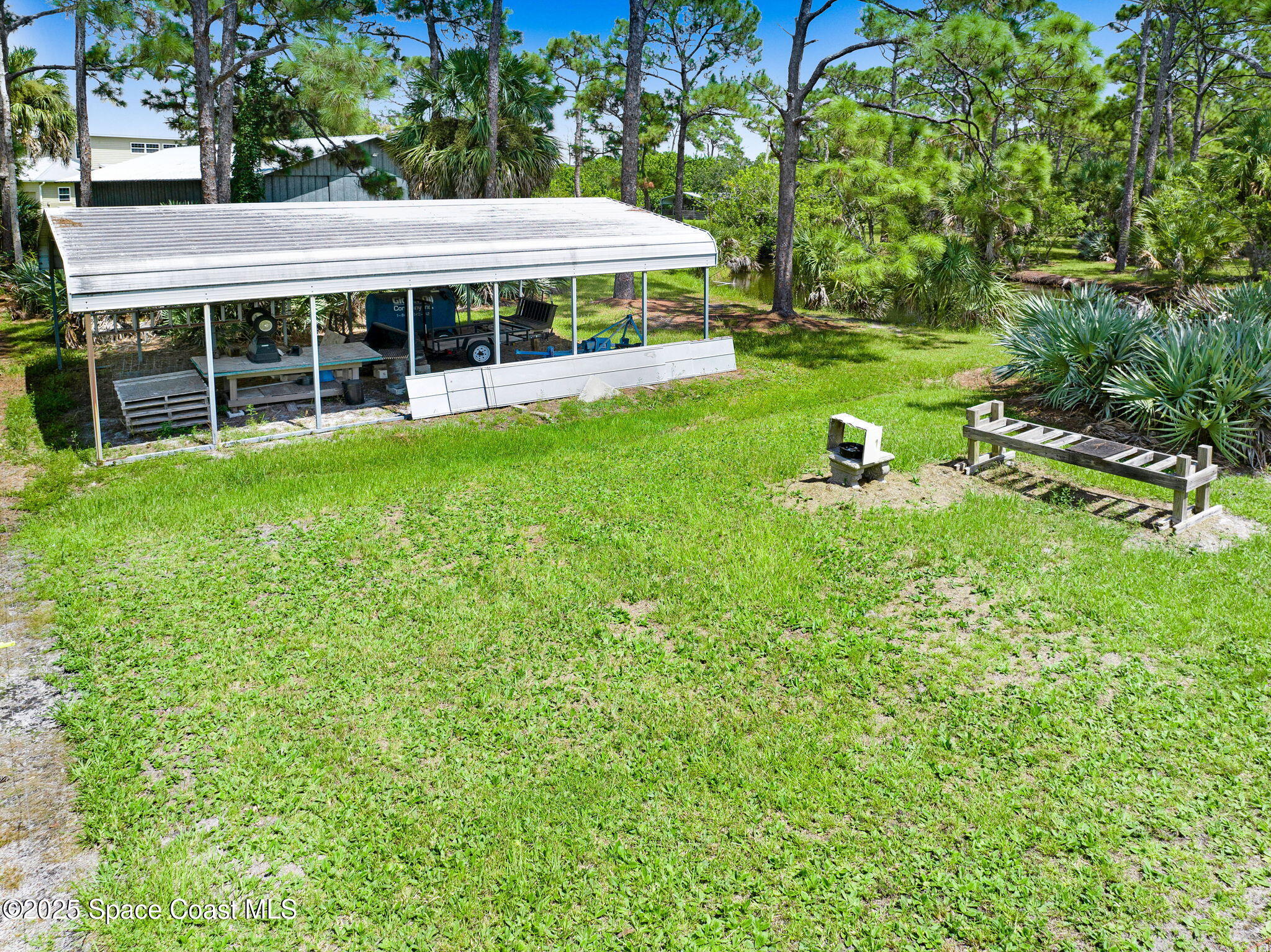 4495 Sand Point Road Grant, FL 32949 - Photo 26 of 87 a view of house with yard and outdoor seating