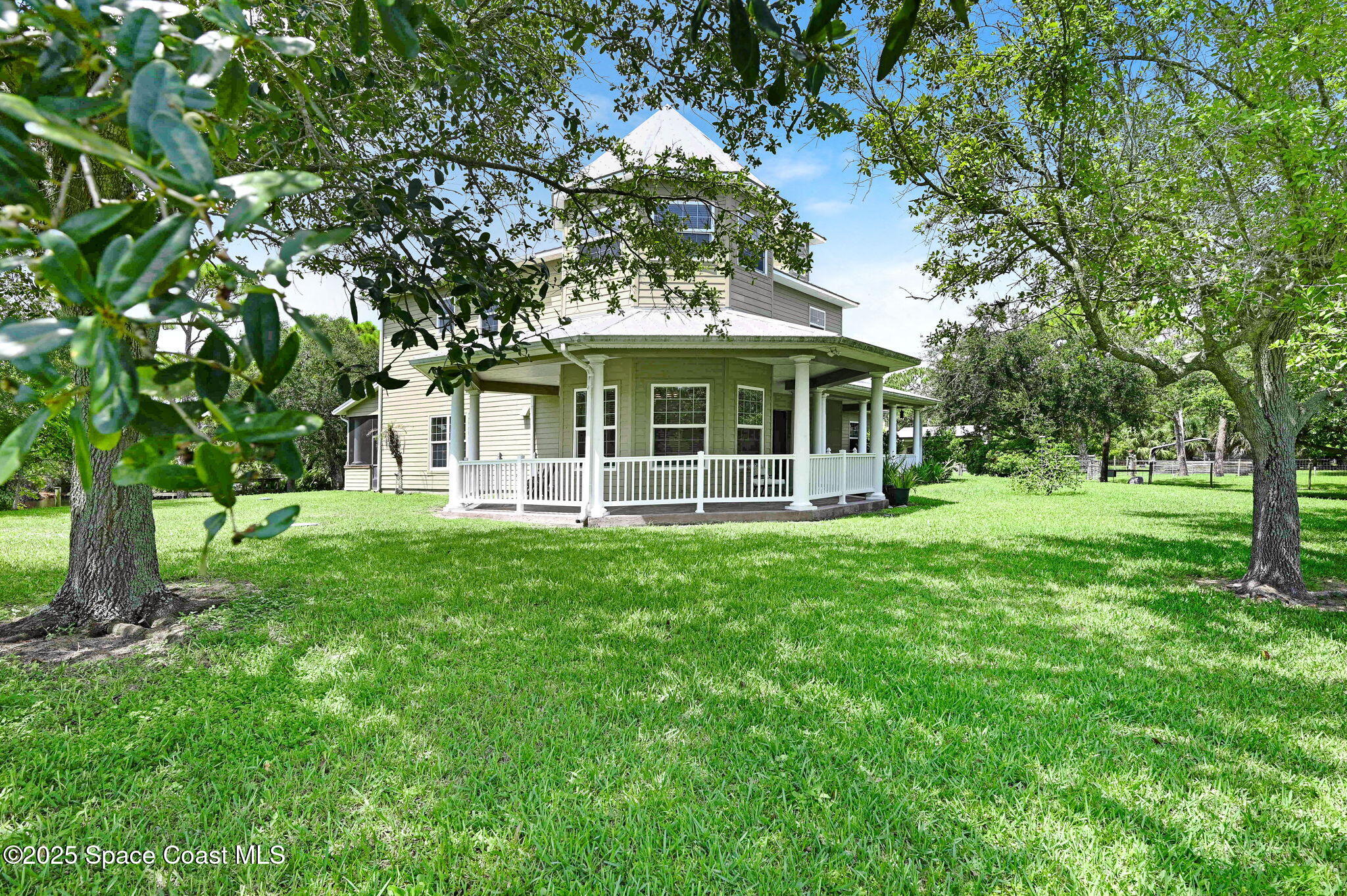 4495 Sand Point Road Grant, FL 32949 - Photo 27 of 87 a view of a house with a backyard