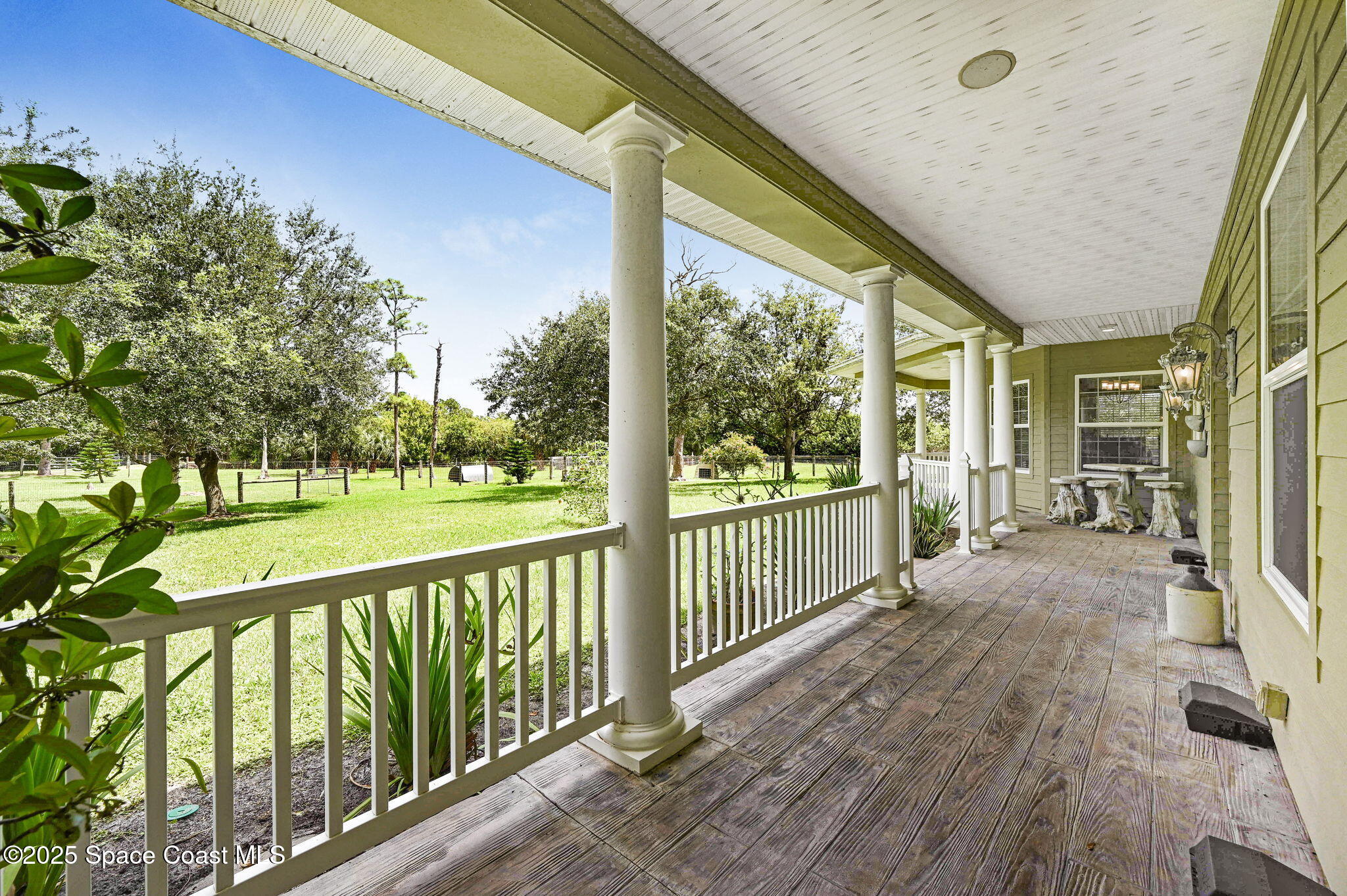 4495 Sand Point Road Grant, FL 32949 - Photo 30 of 87 a view of a porch with wooden floor and outdoor space