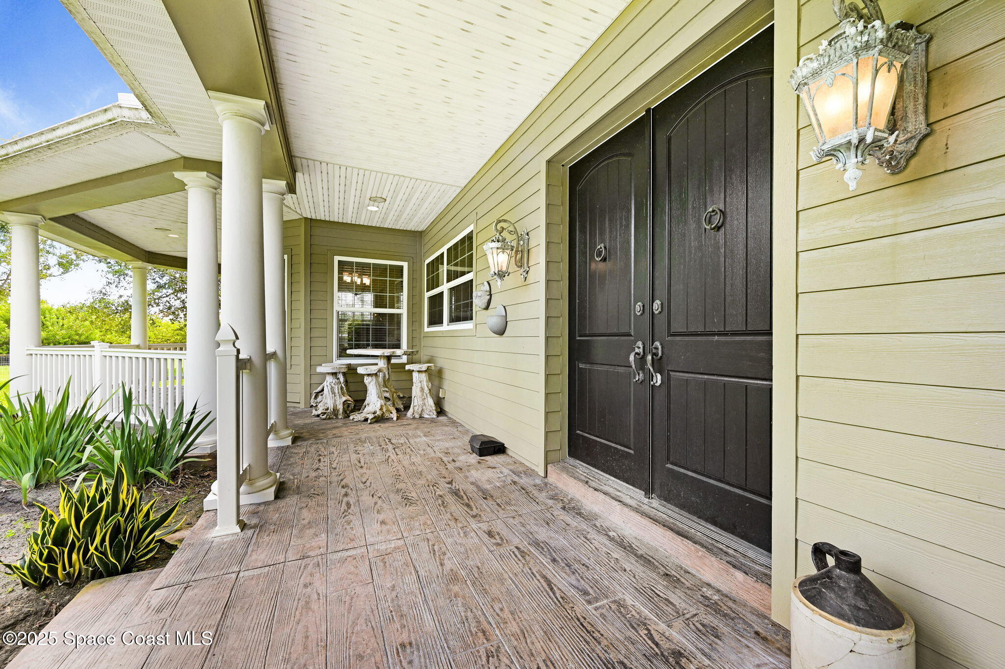 4495 Sand Point Road Grant, FL 32949 - Photo 33 of 87 a view of a hallway with wooden floor and a living room